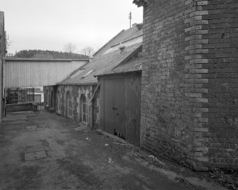 Peebles, March Street, March Street Mills
View from west showing former boilerhouse and stump of polychrome-brick octagonal-section chimney (right)
