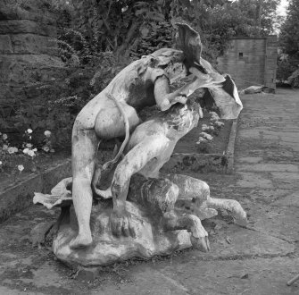 Lead sculpture by Charles Mackie in garden to South of main house, view from West South West.