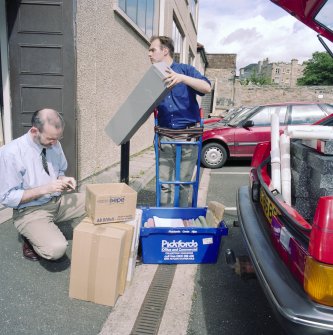 RCAHMS AT WORK.
RCAHMS staff unloading archive material in the RCAHMS car park.