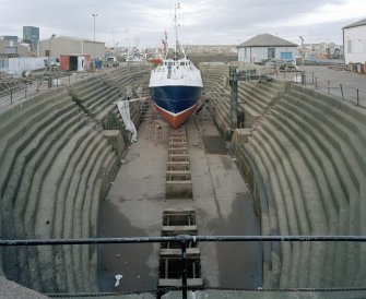 Peterhead, Union Street, North Harbour, Dry Dock
General view into dry dock, showing boat undergoing repairs.