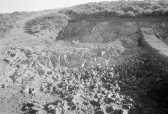 Excavation photograph : area II - face of cut ledge and back wall in northern half, looking east.