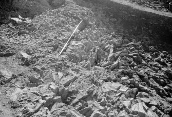 Excavation photograph : area II - face of cut ledge and back wall in northern half, looking south.