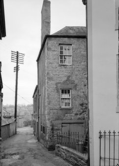 View of north elevations of Abbey Place, Jedburgh from lane from west