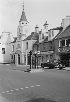 View of Old Town Hall, Stranraer, from north west, and the Railway Inn and a fountain