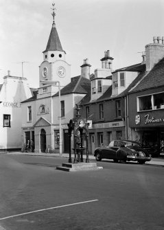 View of Old Town Hall, Stranraer, from north west, and the Railway Inn and a fountain