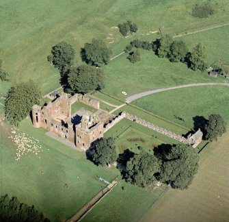 Oblique aerial view centred on Edzell Castle and garden looking NE.