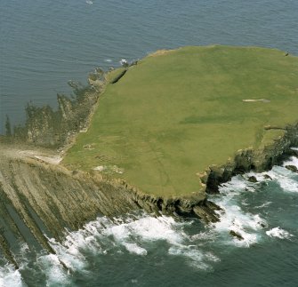 Oblique aerial view of the chapel and settlement at Brough of Birsay.