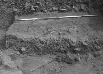 Jedburgh Abbey excavation archive
Frame 16: Area 1: Trench J: Disturbed grave 957. From W.

