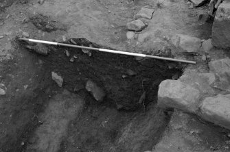 Jedburgh Abbey excavation archive
Frame 18: Area 1: Trench J: Section across ditch 928. From S.