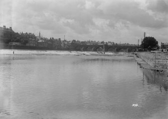 View over River Nith towards Dundee city centre showing bridge