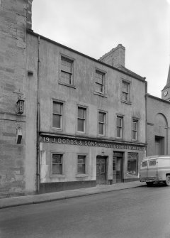 View of 19 Canongate, Jedburgh, from north east showing J Dodds & Sons bakers and confectioners prior to reconstruction.
