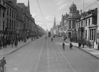 View of Union Street, Aberdeen showing bicycles and tram

