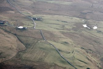 Blackhill and Mountcow, oblique aerial view, taken from the N, showing Blackhill enclosures in the bottom left-hand corner of the photograph, and Mountcow ironstone mine in the centre, to the right of Mountcow farmstead.