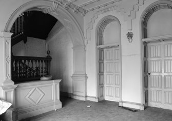 View of the hallway with an arch, ornamental stepped frieze and cornice with a banded ceiling, Rockville, 3 Napier Road, Edinburgh.
