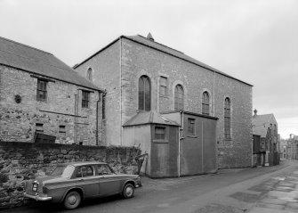 View of rear of the Drill Hall (former Boston Church or Old Relief Church), High Street, Jedburgh, from Queen Street from south east showing modern additions.