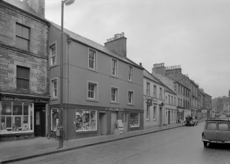 View of 31-23 High Street, Jedburgh from north showing the premises of J Peters Ladies Hairdresser, G Yellowlees and the Bank of Scotland.