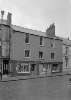 View of 29 and 31 High Street, Jedburgh from north west showing the premises of G Yellowlees.