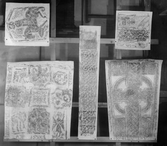 Photographic copy of five rubbings showing a horse and rider on the reverse of Meigle no. 3 Pictish cross slab and four unidentified carved stones.