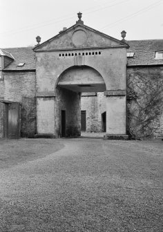 View of Arbigland House stables and dovecot above arch from south east of stables.