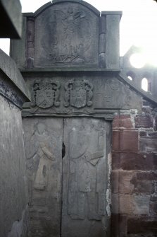 View of mural monuments with carved effigies and armorial panels, Arbroath Abbey Churchyard.