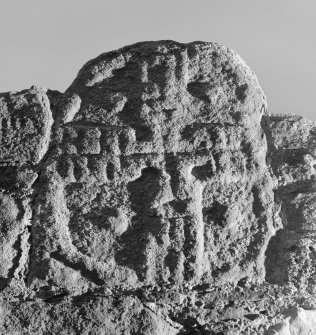 View of Abercrombie no.6 cross-slab fragment in the wall of Abercrombie Church.