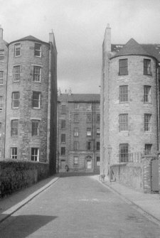 View looking directly along Buccleuch Place Lane, Edinburgh, between the rear of the south side of Buccleuch Place with the north side in the background, seen from the south south east.