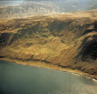 Oblique aerial view centred on the remains of the township, rig and trackway, taken from the NE.