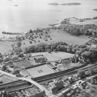 Oblique aerial view of Aberdour village, showing Aberdour Castle, St Fillan's Church and the harbour
