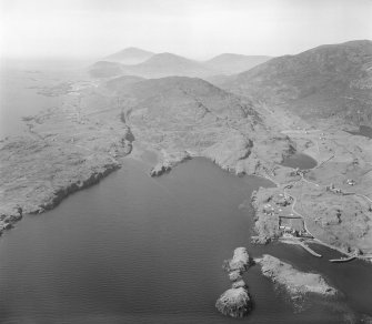 Oblique aerial view of Rodel, Harris, showing a distant view of St Clement's Church.