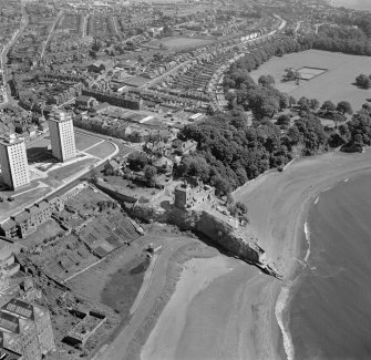 Oblique aerial view centred on Ravenscraig Castle, Kirkcaldy, showing Pathhead tower blocks from south west.