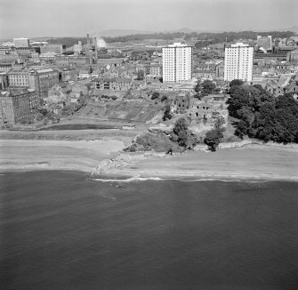 Oblique aerial view of Ravenscraig Castle and Pathhead tower blocks, Kirkcaldy from south east.