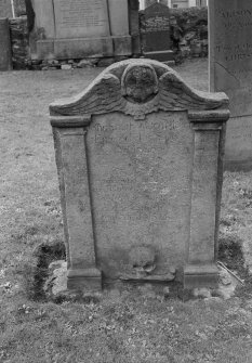 View of gravestone commemorating John Smith, watchmaker, who died 1814 and his spouse Helen Brown who died 1771, in the churchyard of Pittenweem Parish Church.
