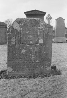 View of gravestone in the churchyard of Rescobie Parish Church with initials 'A P' and 'M S' and dated 1735, and to John Peters 1808 and Isobel Dickson 1841.