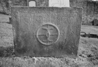 View of west face of gravestone with miller's stone and initials 'W S' and 'M A' in the churchyard of Alloa Old Parish Church.