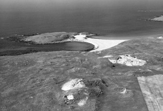 Oblique aerial view of Coileagan An Udal settlement, North Uist
