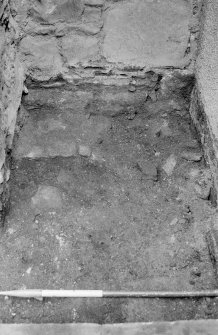 Excavation photograph : record shot of A, after removal of bedding of paving, looking east.