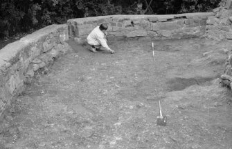 Excavation photograph : general view of area to W of ruins, showing rubble spread 106, 116, looking north.