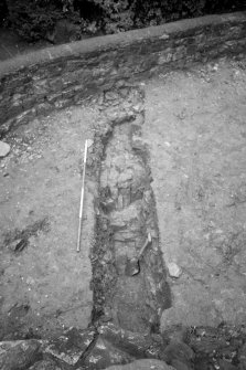 Excavation photograph : sondage to west of ruins with 125 partially excavated, looking west.