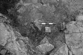 Excavation photograph : burnt deposit in 128, looking north.