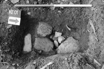 Excavation photograph : trench Q - stones, looking west.