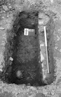 Excavation photograph : wall and skeleton in R looking north.