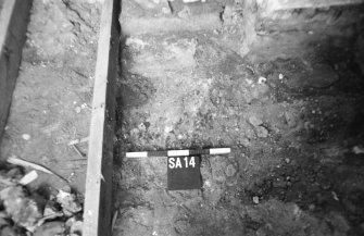 Watching brief photograph : detail of layers under floor, looking south.