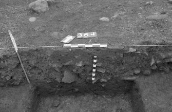 Castle of Wardhouse excavation archive
Area 3: Section through linear feature 364, just to S of wall 322. Cutting upper bank 337. From SE.