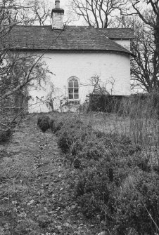 View of S bay of SW elevation of cottage by walled garden, Parton House.