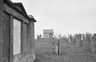 General view of Whitsome Old Parish Churchyard and watchhouse.