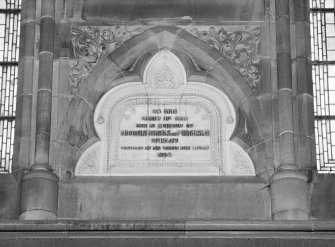 Interior.
Detail of commemorative plaque on S wall.