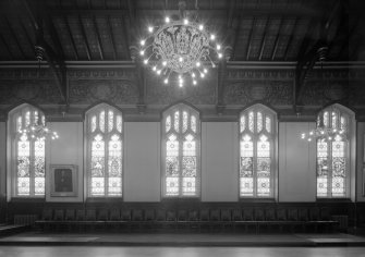 Interior view of Trinity Hall, Union Street, Aberdeen, showing stained glass windows along side wall of large hall.