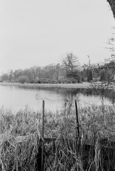 Distant view of Dalswinton House dovecot from across loch.