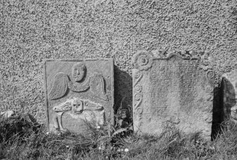 View of headstones to John Ormston 1732 and Adam Henderson in the churchyard of Eckford Parish Church.