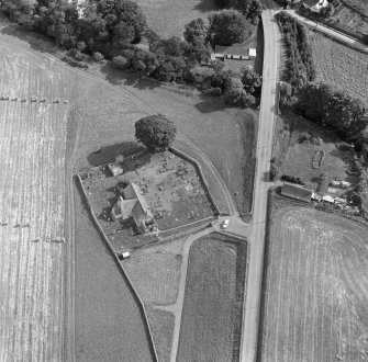 Oblique aerial view of Edderton Parish Church and churchyard.
